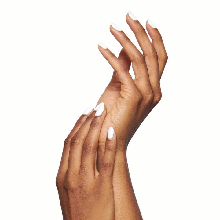Hands with long nails painted in crisp white HD polish against a clean white background for manicure display
