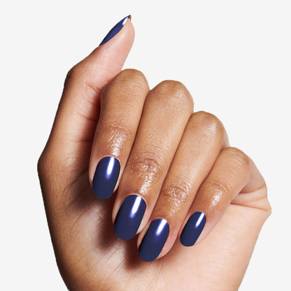 Hand with glossy navy nails showing Long Lasting Top Coat for durable at-home manicure shine and protection