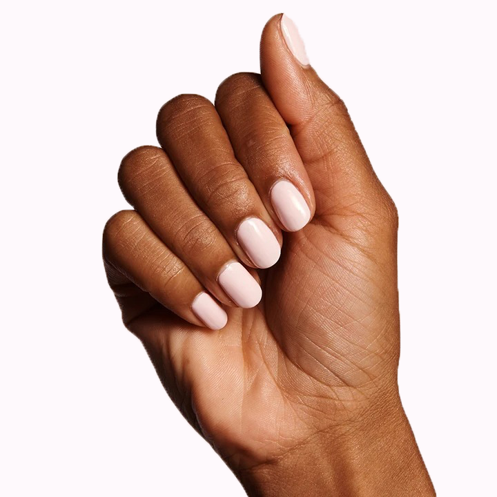 Hand with nails painted in GH, a versatile opaque baby pink polish perfect for a glowing at-home manicure