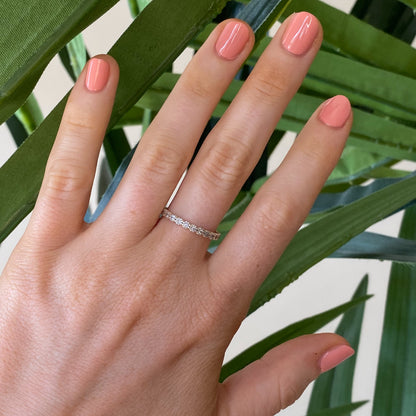 Hand with nails polished in Wild & Free coral shade for a fresh and long-lasting at-home manicure look