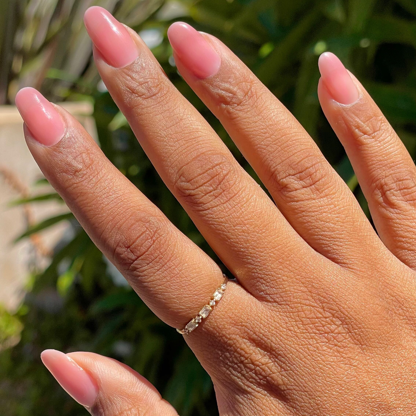 Blush Jelly - Builder Gel on natural nails with a smooth sheer rosy pink mani in natural sunlight outdoors