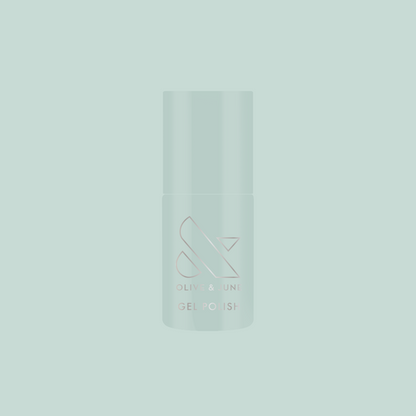 KMC - Gel bottle shown in sage green packaging on a matching background representing long-lasting gel polish by Olive and June