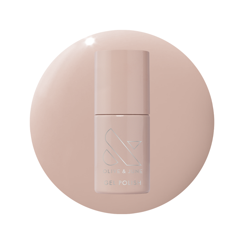 Bottle of CDJ - Gel nail polish by Olive and June in a creamy neutral shade on matching background