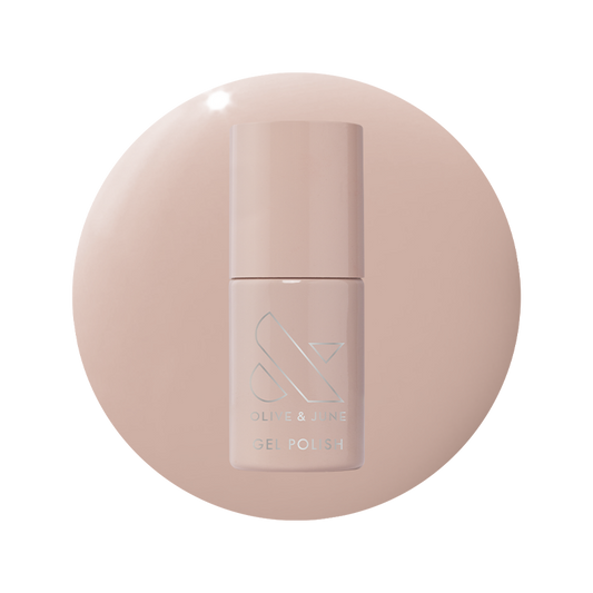 Bottle of CDJ - Gel nail polish by Olive and June in a creamy neutral shade on matching background