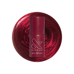 Budget? What Budget Gel deep rose-orange duochrome gel polish bottle on swirled polish background for mani or manicure