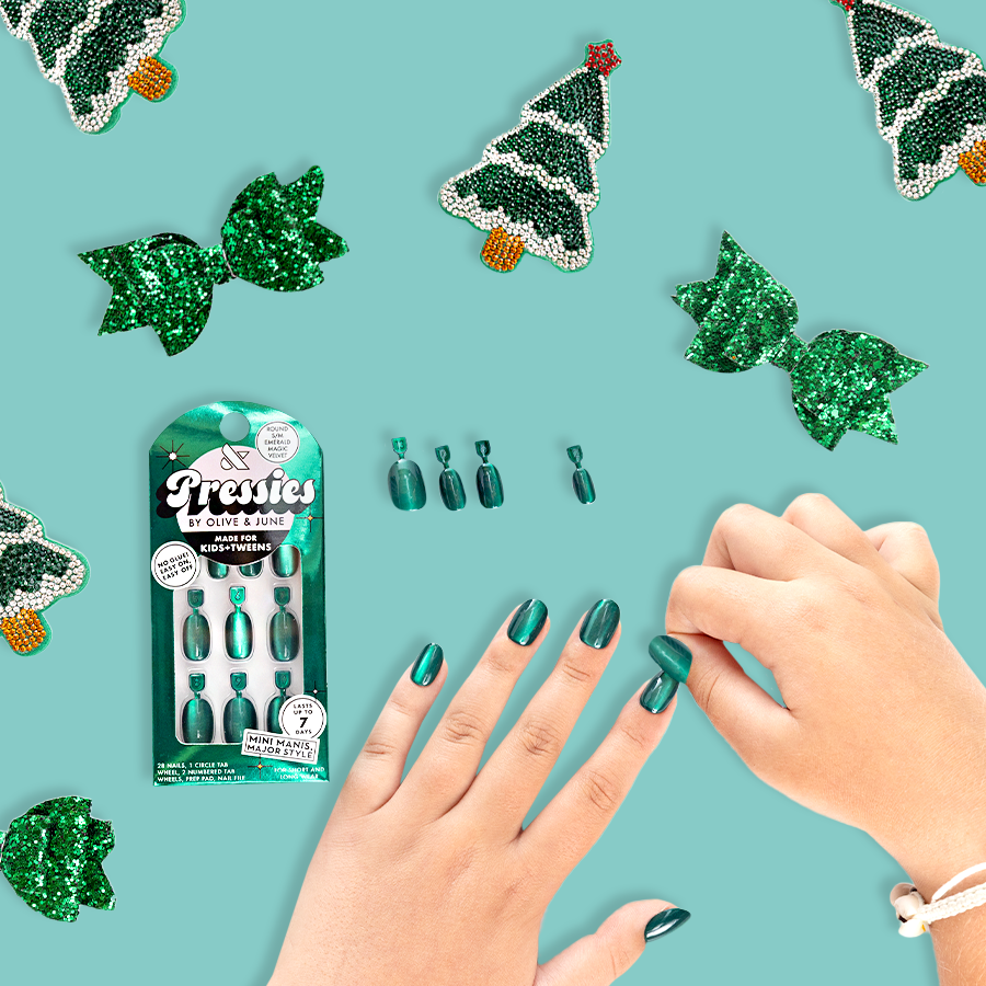 Emerald Magic Velvet - Pressies | Short Medium | Round showing glossy deep green press-on nails with holiday decor background