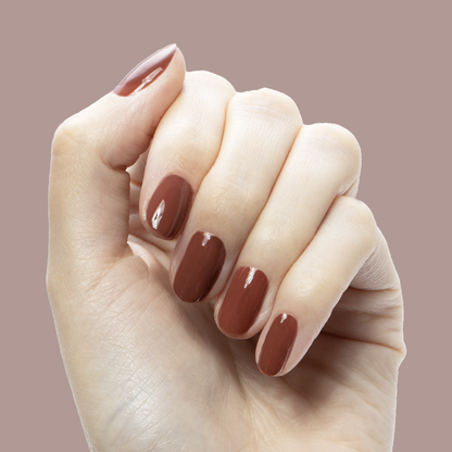 JJ - Gel on natural nails in a warm cinnamon brown shade for a cozy, long-lasting manicure by Olive and June