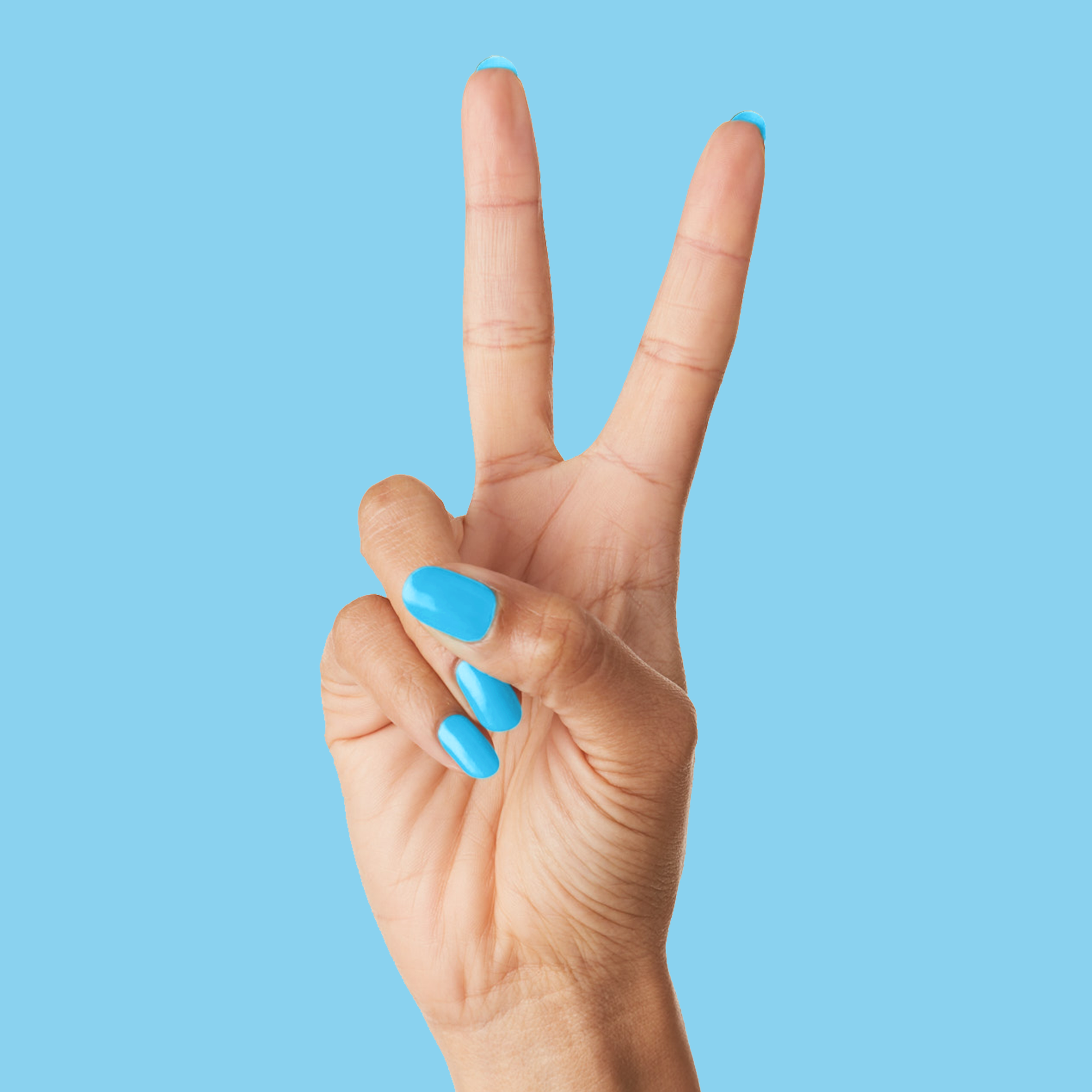 Hand showing peace sign with nails painted in glossy bright Megababe Blue gel polish on blue backdrop