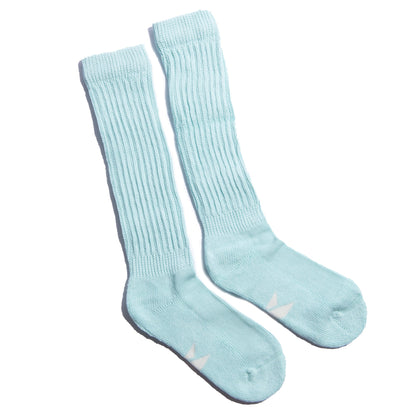 The Mint Slumber Party Set features soft mint green cozy socks designed for overnight foot care and heel balm use