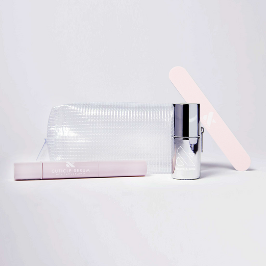 The K.I.T. Kit by Olive and June with cuticle serum, nail polish, file, and clear pouch for at-home manicures