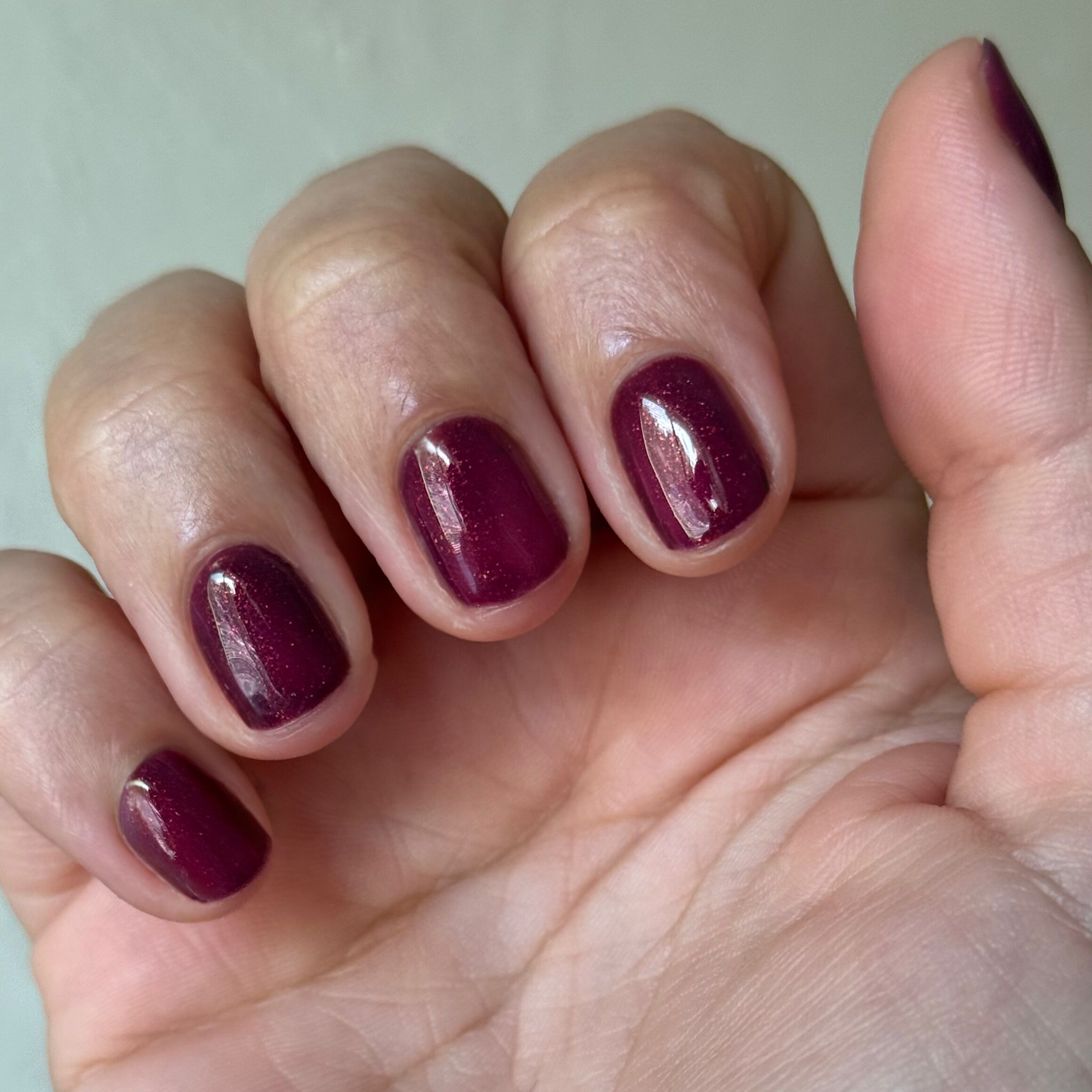 On the Promenade - Gel on short natural nails in shimmering mulberry purple for a glossy long-lasting manicure by Olive and June