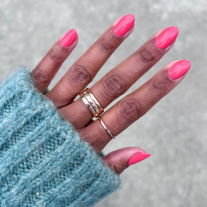 Perfect Pinwheel coral gel polish on natural nails with a smooth, glossy finish for a bright at-home manicure