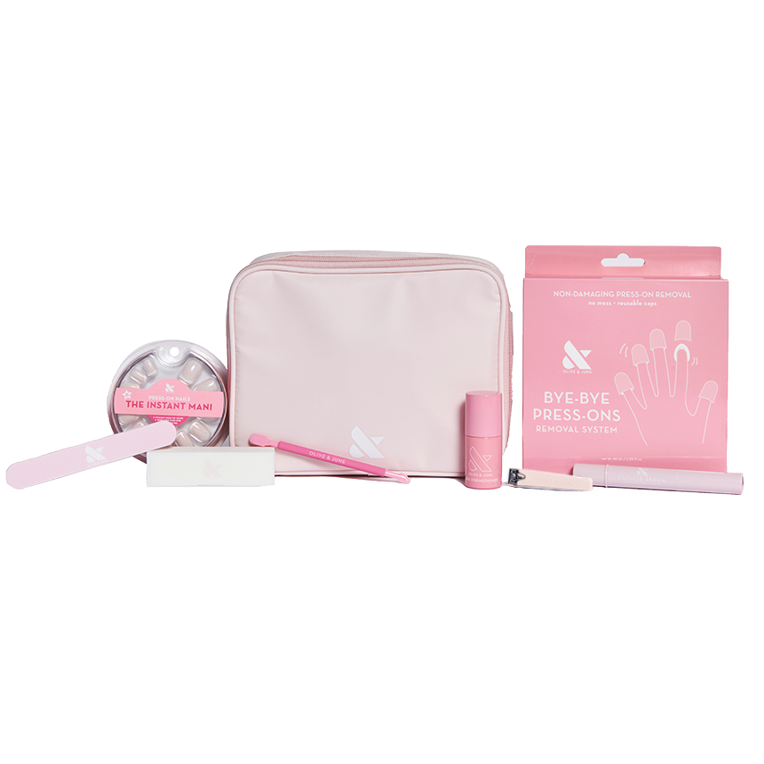 Press-On System - 4 Sets displayed with pink pouch, nail file, remover kit, brush, and nail polish for easy at-home mani care