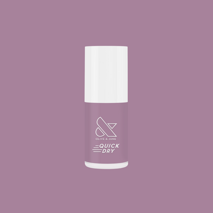 Bottle of Dreamy sheer milky pastel lavender quick dry gel polish by Olive and June on a matching lavender background