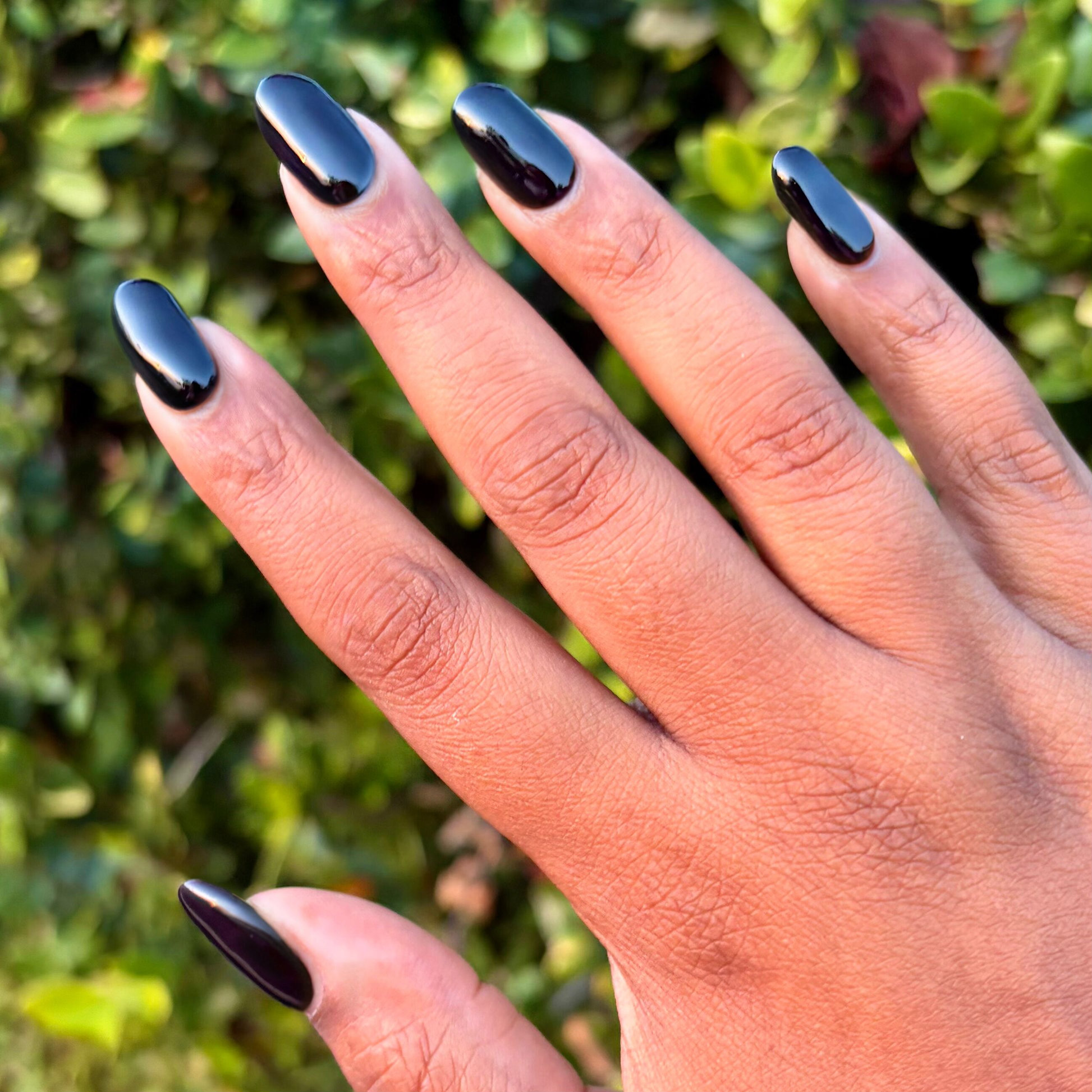 Shop Til You Drop Gel on medium-length natural nails in deep vampy red for a polished long-lasting mani