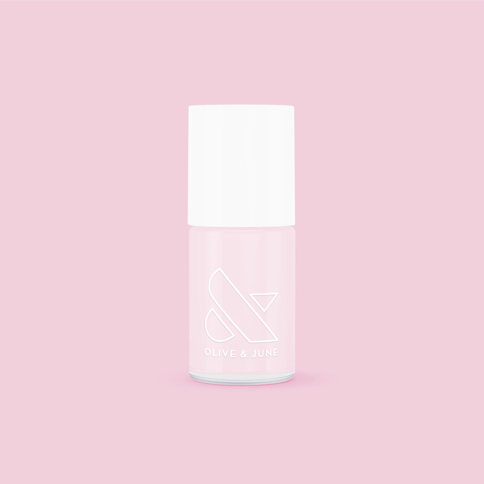 Olive and June Strawberry Scone nail polish bottle on pink background for sheer pink long-lasting mani