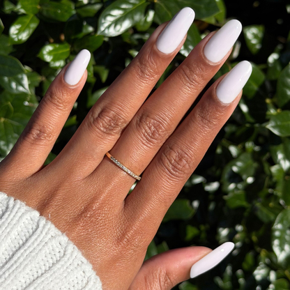 TT - Gel on long almond-shaped nails in a smooth, soft lavender polish with subtle grey undertones for a polished mani by Olive and June