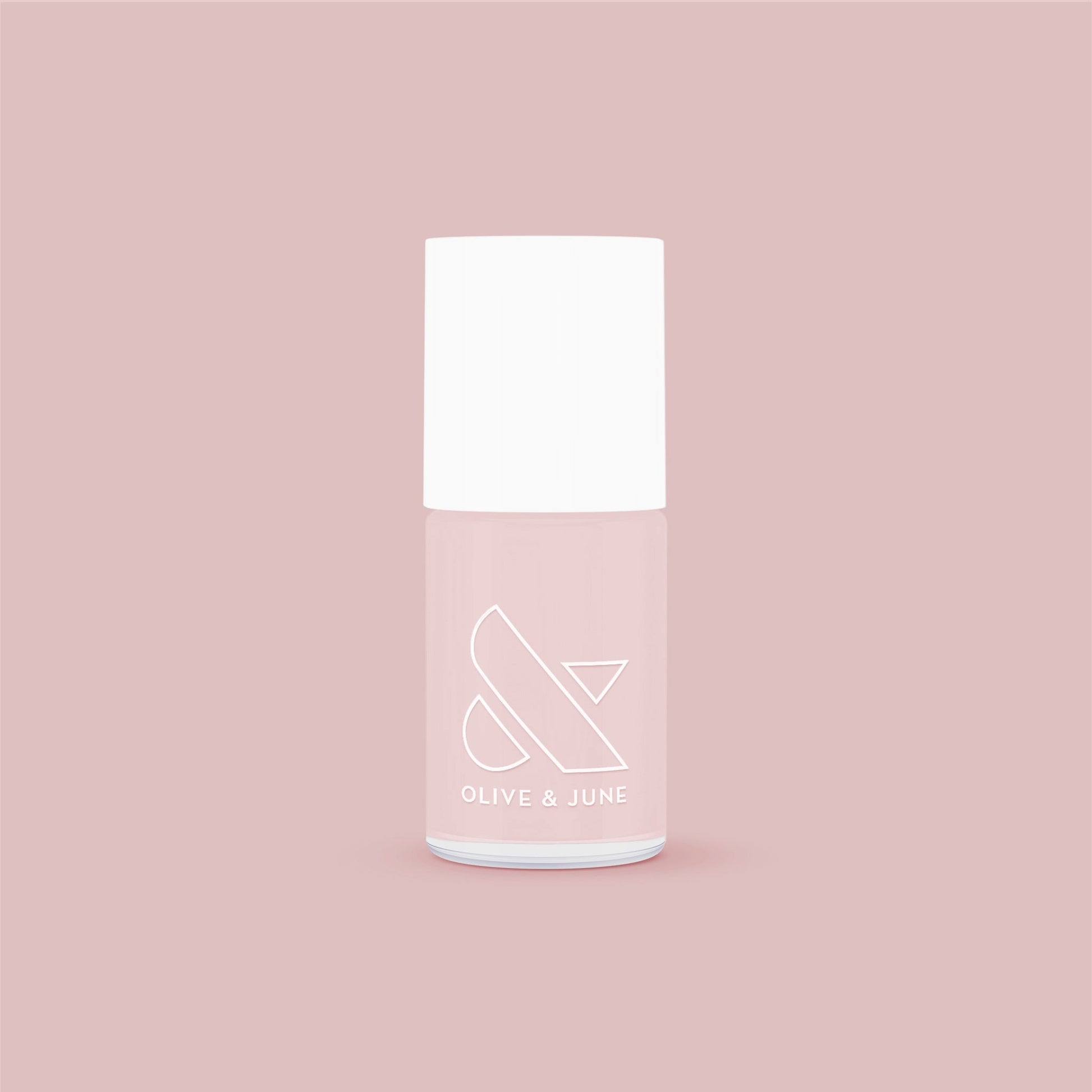 Olive and June nail polish bottle in soft neutral mauve shade The Queen Takes her Tea with Milk for elegant mani at home