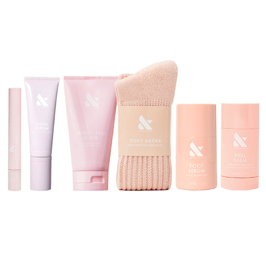 Mani Pedi Reset Set with hand serum, scrub, cozy socks, foot serum, and heel balm for hydration and care