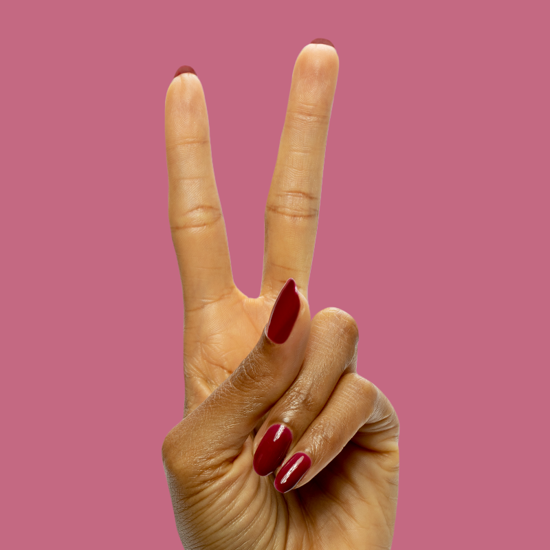 Mulberry - Gel deep maroon gel polish on natural nails showing a glossy, long-lasting manicure by Olive and June