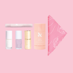 The Glazed Frosting Set featuring quick dry polishes, top coat, heel balm, cuticle serum, and cotton handkerchief for mani care