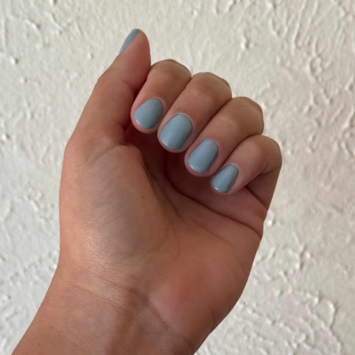 Vintage - Gel shown on hand with smooth vintage denim blue nails for a classic, long-lasting gel polish manicure by Olive and June